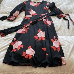 Black dress with floral motif puffed sleeves